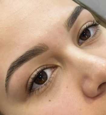a close up of a woman with brown eyes